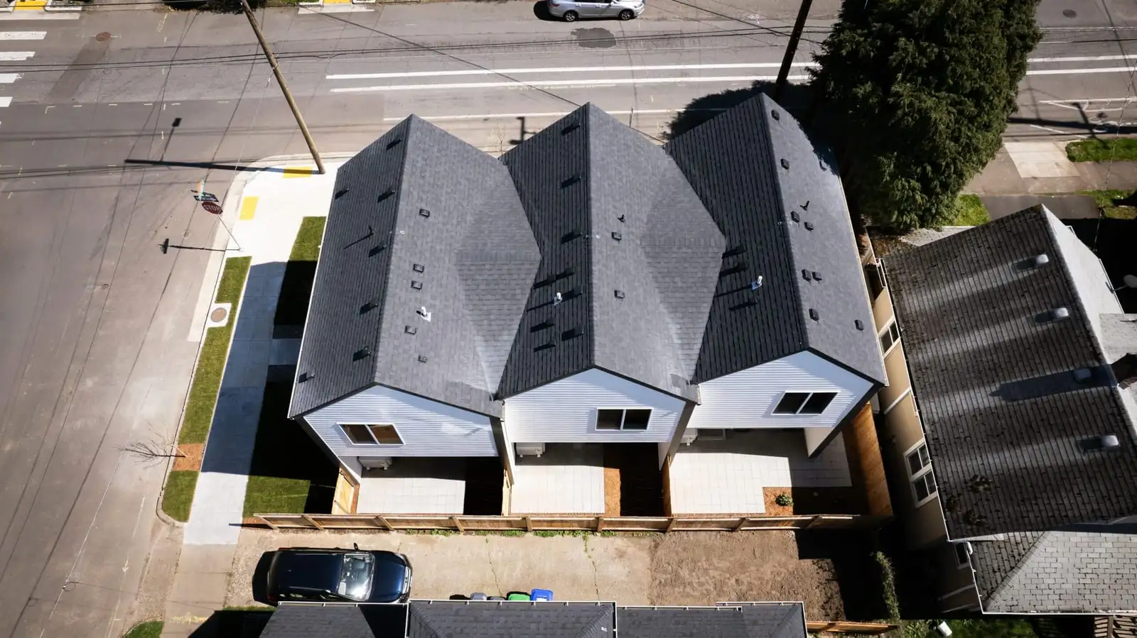 Aerial view of new townhomes with fenced backyards in Portland, OR